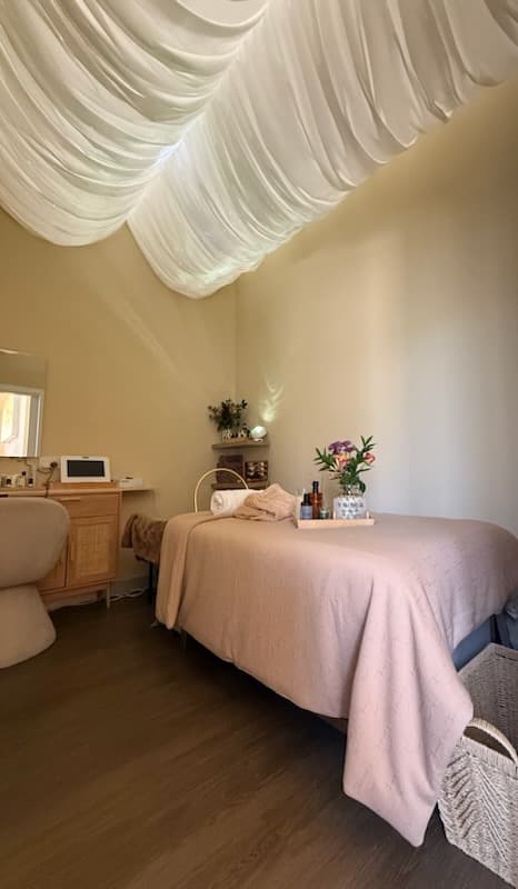 Draped treatment room with linen canopy at Havenly Wellness & Head Spa
